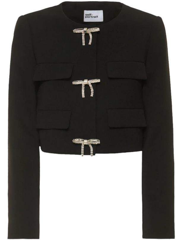 Jas wanita dengan potongan cropped dan aksen pita di bagian belakang